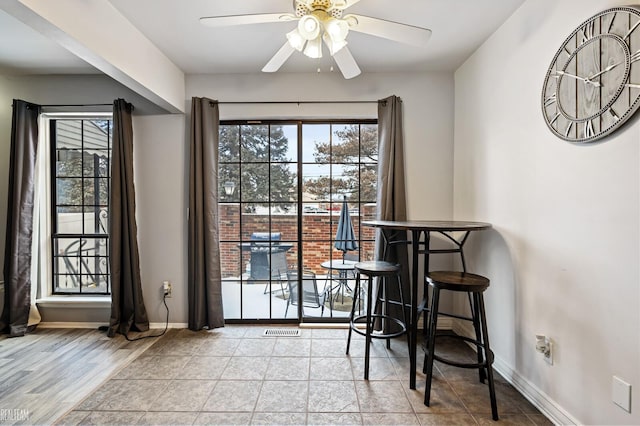 dining room with plenty of natural light and ceiling fan