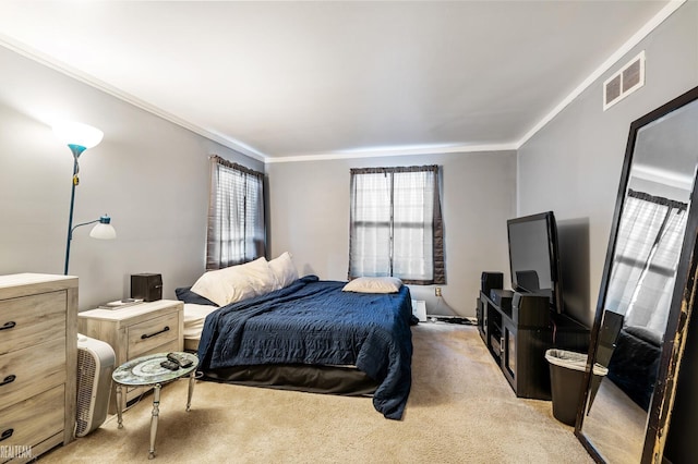 bedroom featuring ornamental molding and light colored carpet