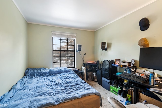 bedroom with ornamental molding and carpet