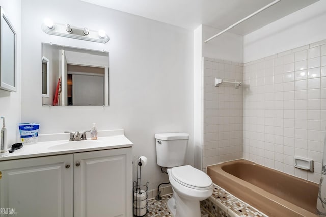 full bathroom with vanity, toilet, and tiled shower / bath combo