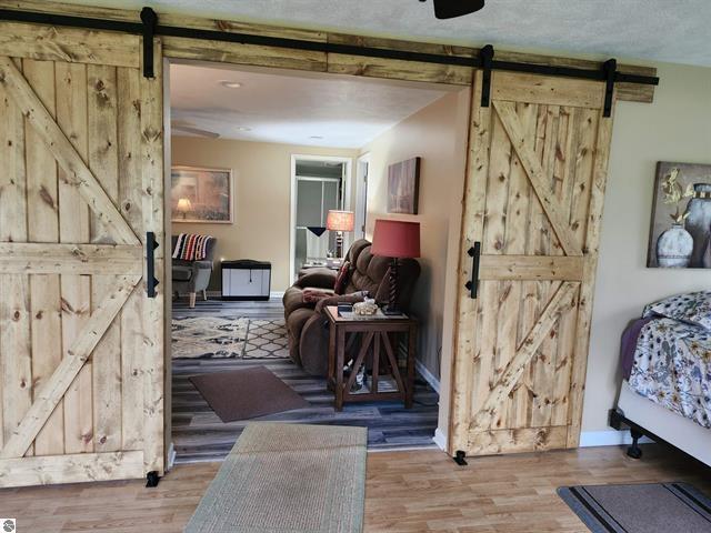 interior space with a barn door and light wood-type flooring