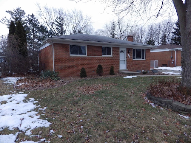 view of front of house with a yard