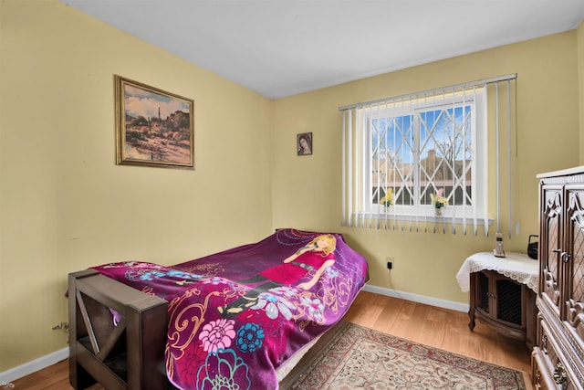 bedroom with wood-type flooring