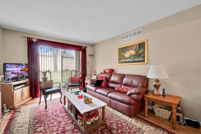 living room with light hardwood / wood-style flooring