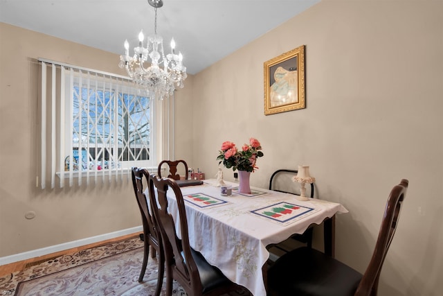 dining space with a chandelier