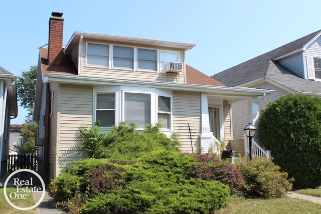 view of front facade featuring cooling unit