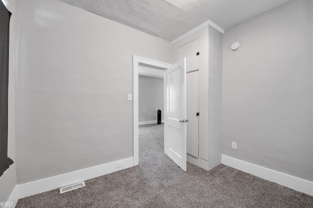 unfurnished room with carpet floors