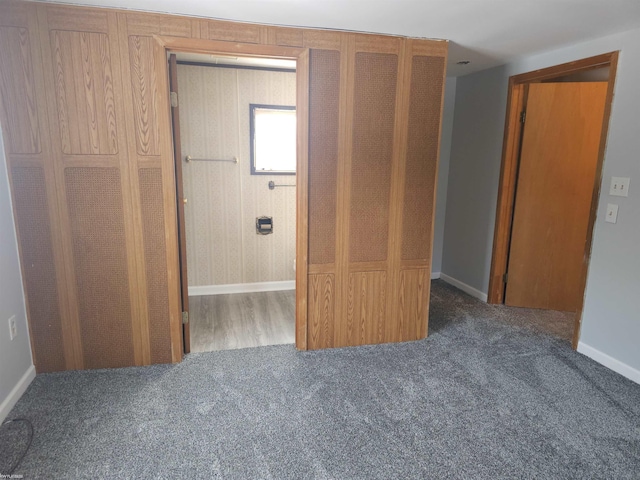 unfurnished bedroom featuring dark colored carpet