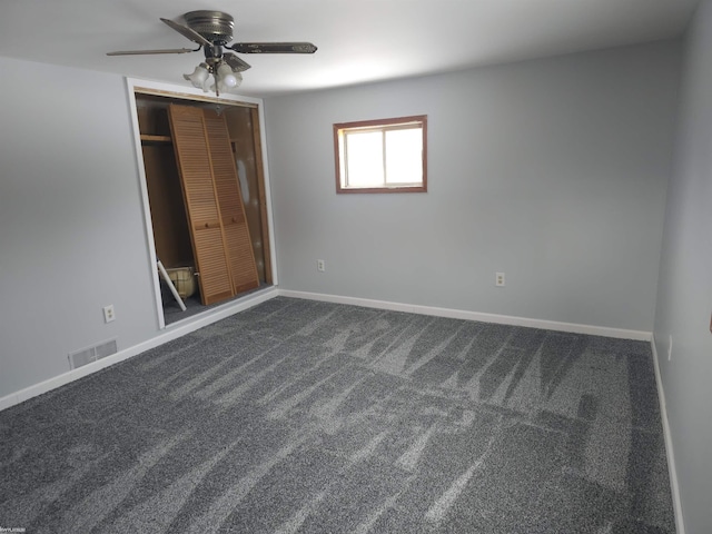 interior space featuring ceiling fan and carpet floors