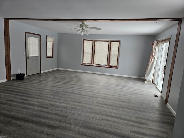 interior space with dark hardwood / wood-style floors and ceiling fan