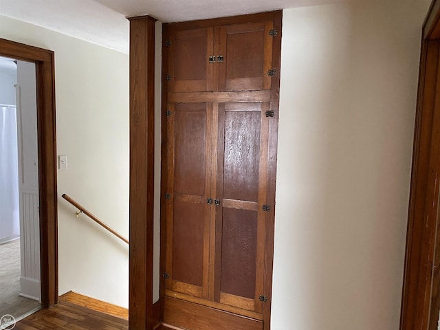 corridor featuring dark hardwood / wood-style floors