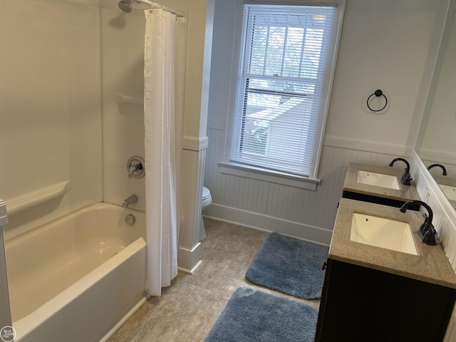 full bathroom featuring vanity, toilet, and shower / tub combo with curtain