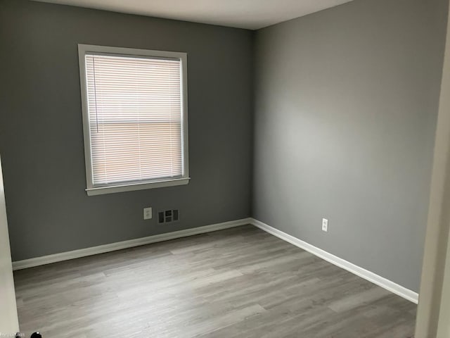 empty room featuring light hardwood / wood-style floors