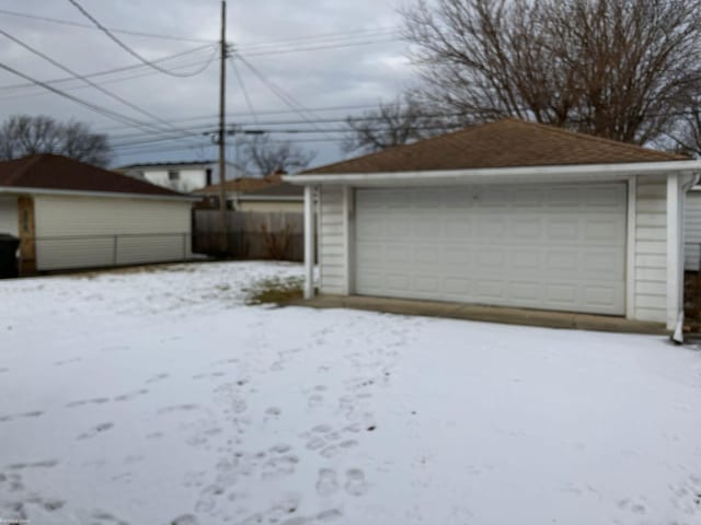 view of snow covered garage