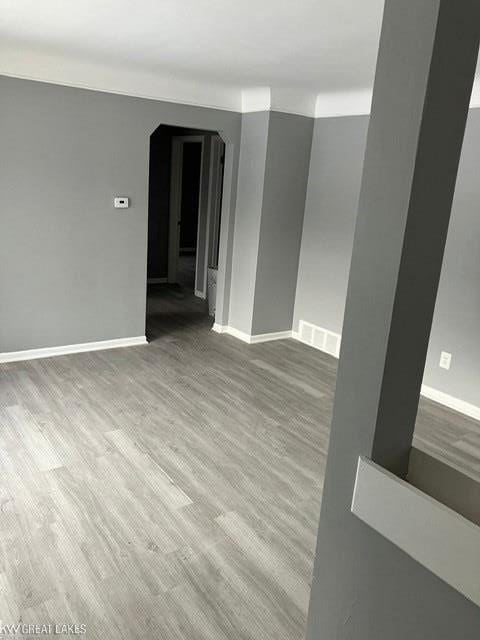 unfurnished room with hardwood / wood-style floors