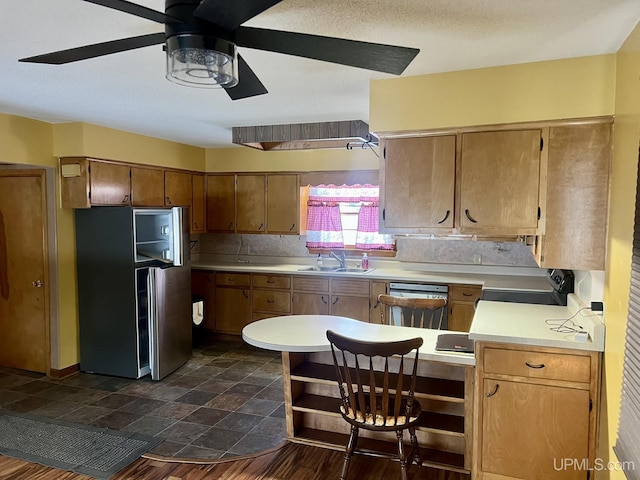 kitchen with tasteful backsplash, ceiling fan, stainless steel appliances, and sink