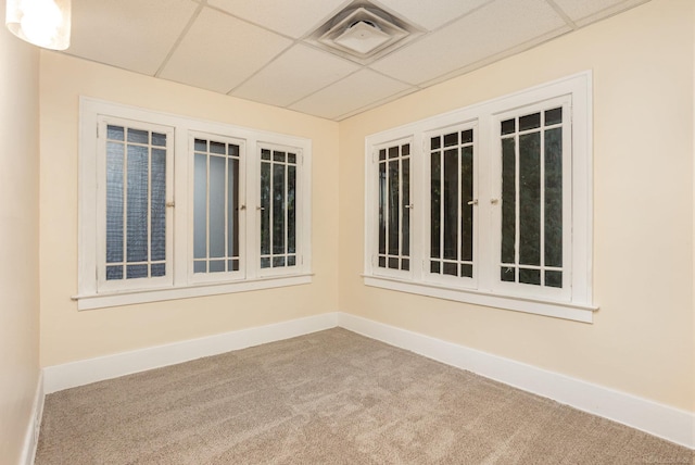 interior space featuring a drop ceiling