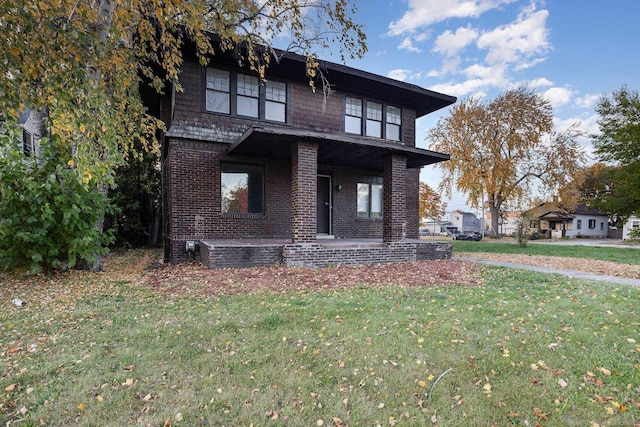 view of front facade with a porch and a front yard