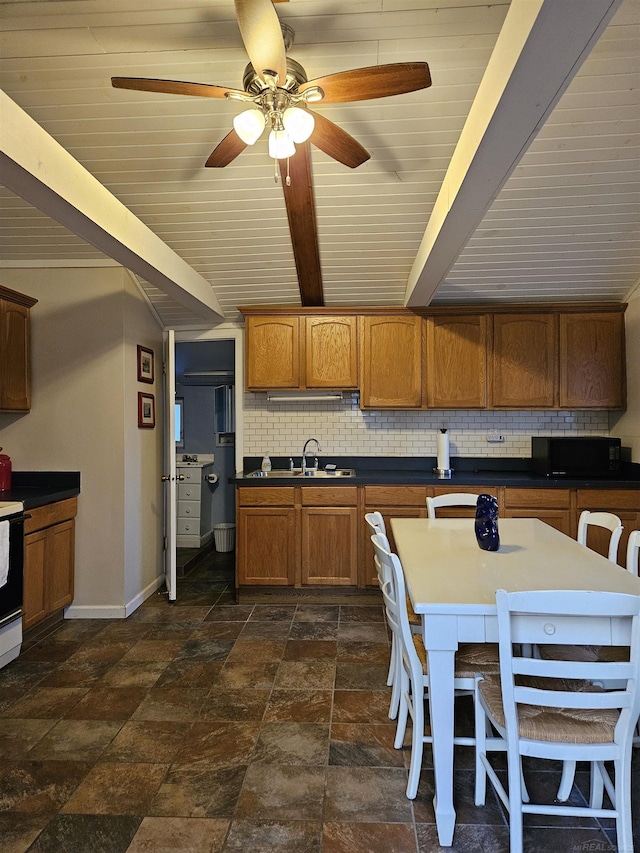 kitchen featuring sink, ceiling fan, backsplash, beam ceiling, and range with electric stovetop