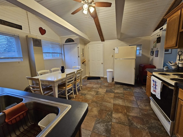 kitchen featuring vaulted ceiling with beams, white appliances, a wealth of natural light, and ceiling fan