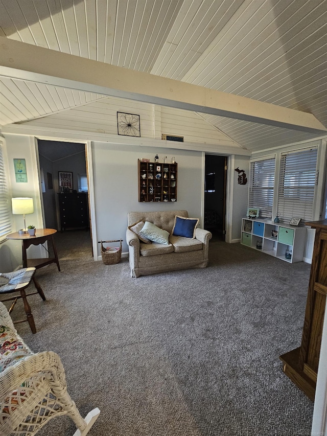 carpeted living room featuring lofted ceiling with beams