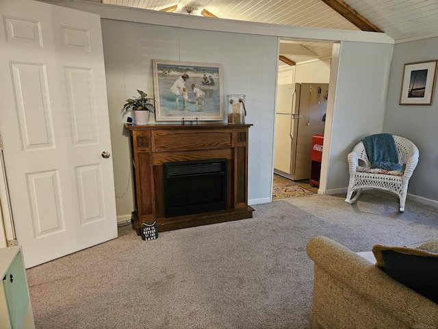 living room with vaulted ceiling with beams and light carpet