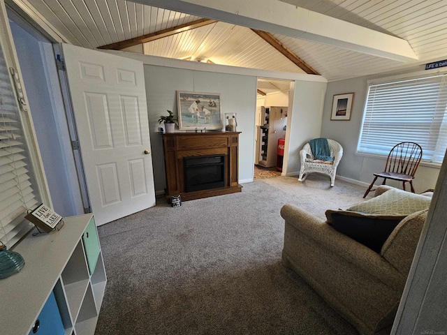 carpeted living room with vaulted ceiling with beams and wooden ceiling