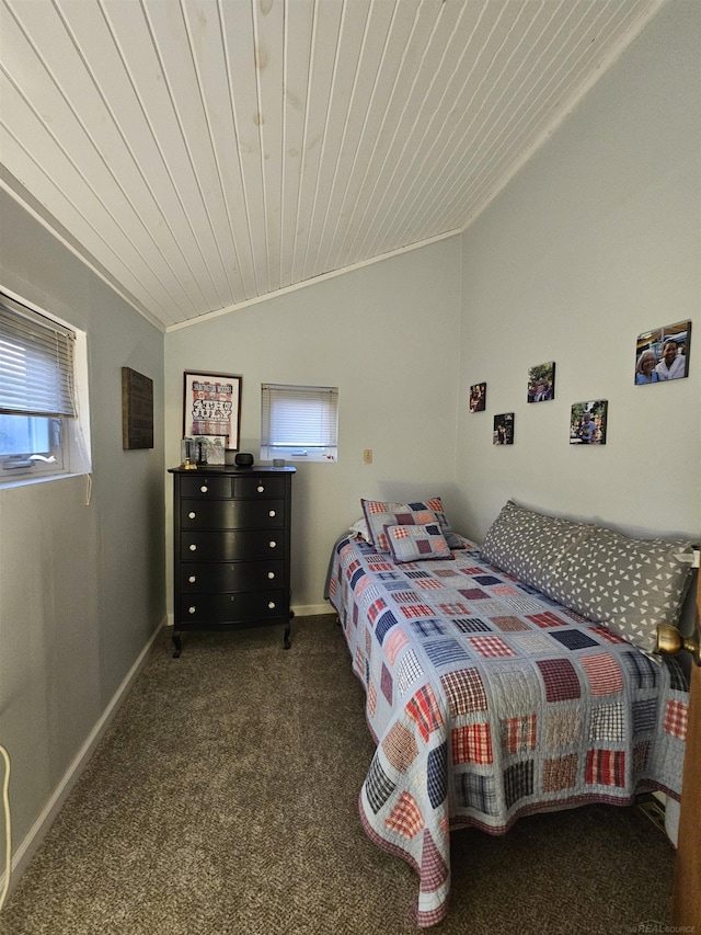 bedroom with wood ceiling, lofted ceiling, and dark colored carpet