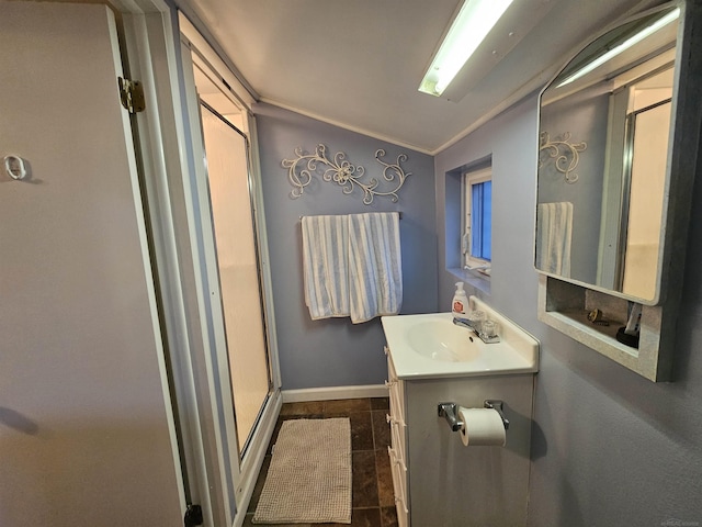 bathroom with vanity, an enclosed shower, and ornamental molding