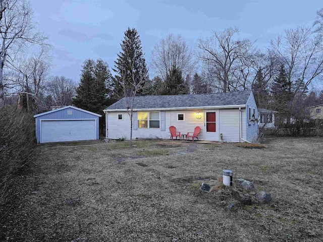 ranch-style house with an outbuilding and a garage