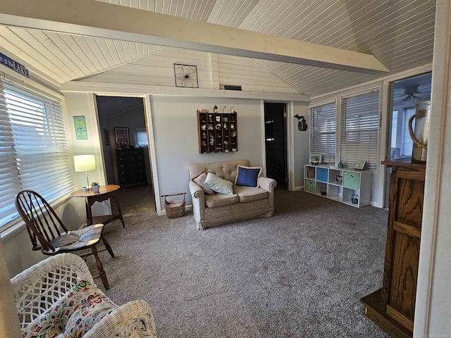 carpeted living room featuring lofted ceiling with beams