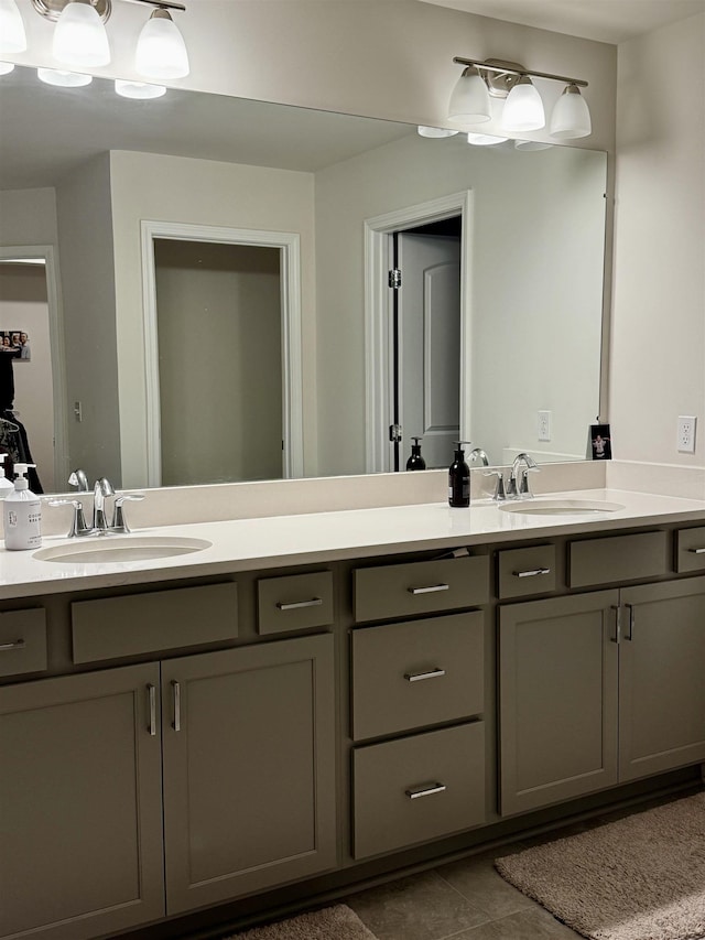 bathroom with tile patterned floors and vanity