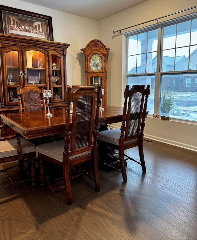 dining area featuring dark hardwood / wood-style flooring and a wealth of natural light