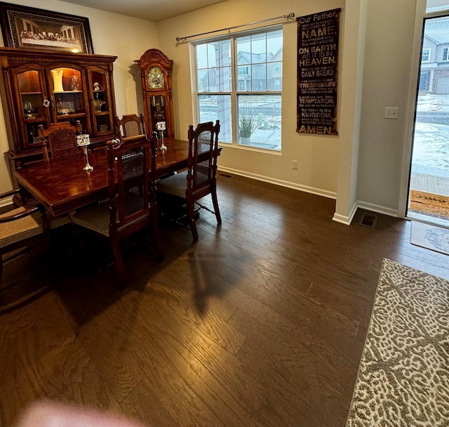 dining area featuring dark hardwood / wood-style flooring