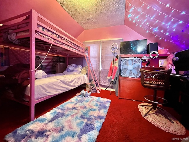 carpeted bedroom featuring vaulted ceiling and a textured ceiling