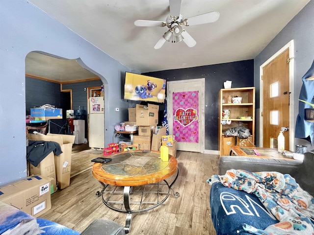 living room featuring hardwood / wood-style floors and ceiling fan