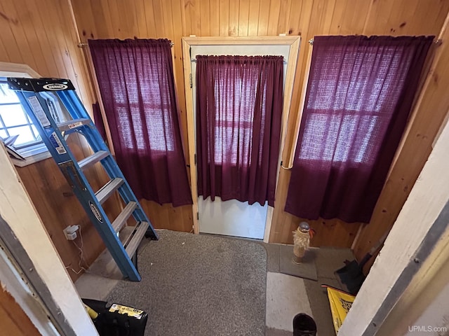 interior space featuring wooden walls