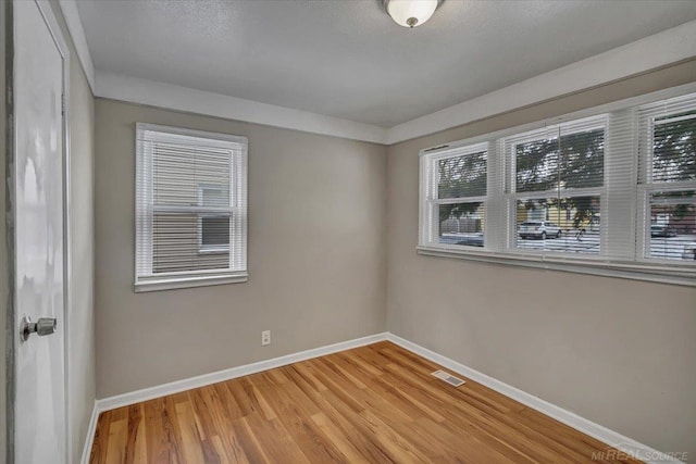 empty room featuring hardwood / wood-style floors