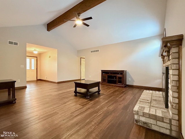 living room featuring ceiling fan, hardwood / wood-style floors, beam ceiling, high vaulted ceiling, and a fireplace