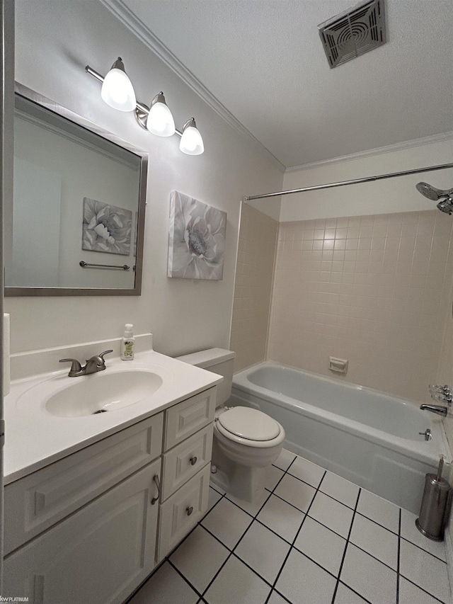 full bathroom featuring tiled shower / bath combo, vanity, toilet, tile patterned floors, and a textured ceiling