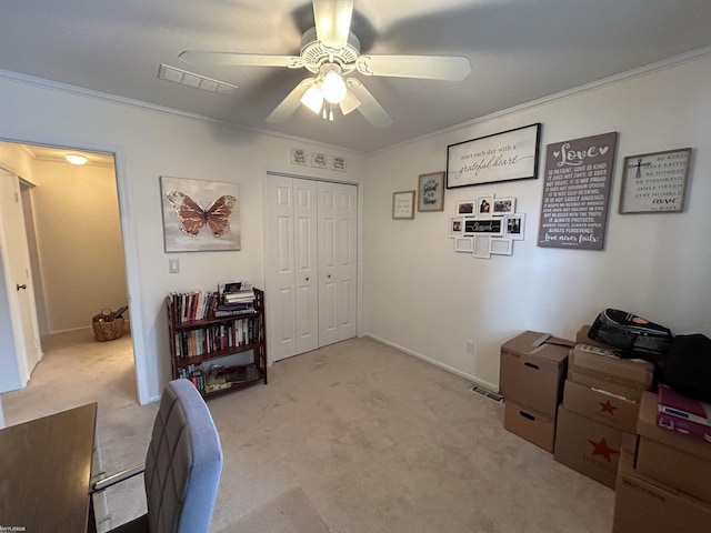 carpeted home office with crown molding and ceiling fan