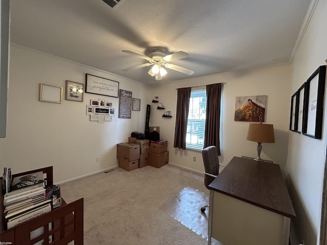 home office with crown molding, light carpet, a textured ceiling, and ceiling fan