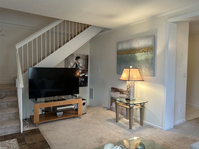 living room featuring ornamental molding and carpet