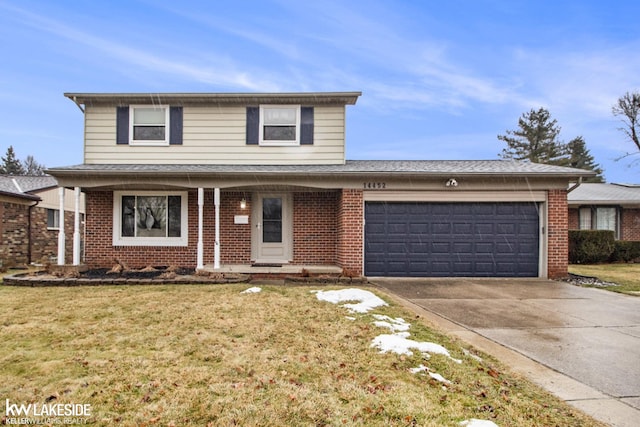 front of property featuring a garage and a front yard