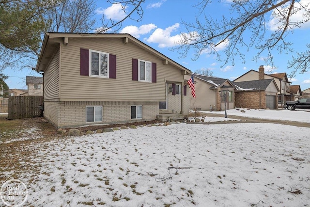 view of snow covered house