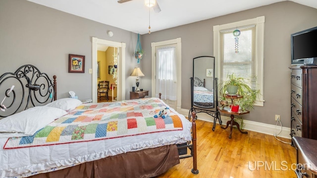 bedroom featuring wood-type flooring and ceiling fan