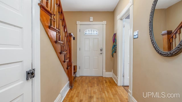 doorway to outside with light wood-type flooring