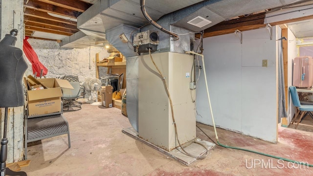 basement featuring heating unit