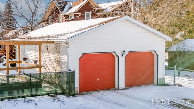 view of snow covered garage