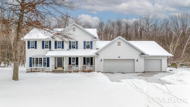 view of front facade featuring a garage and a porch